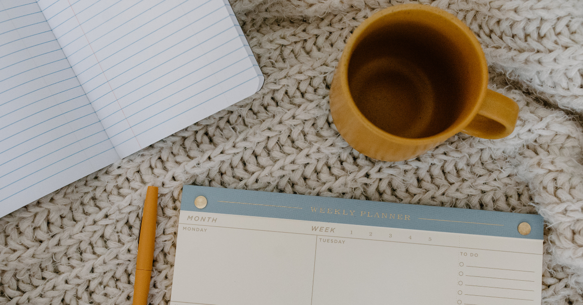 notebook and coffee cup
